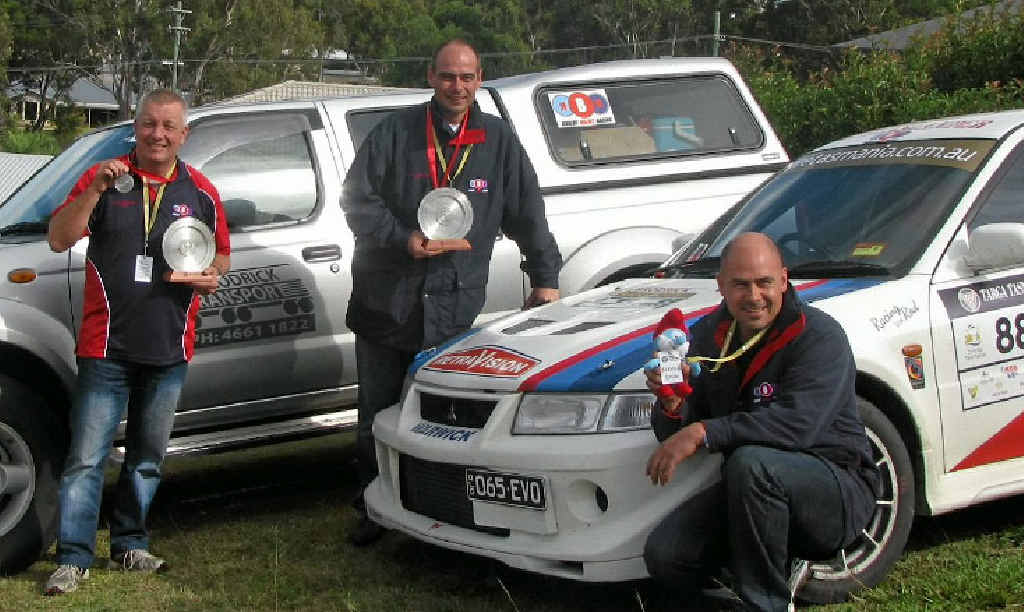 Peter Lane, Robert Balint and Gerard Balint with their Targa completion plates and medal. Peter Lane, Robert Balint and Gerard Balint with their Targa completion plates and medal.